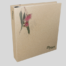 A property handover ring binder with a natural cardboard cover featuring a printed image of a pink flower and green leaves, with "MyHome" printed in small black letters at the bottom right.